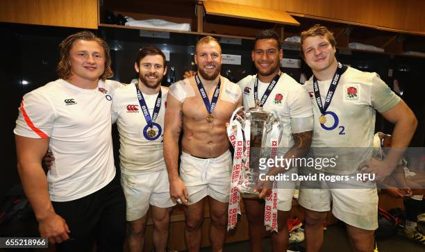 Tommy Taylor, Elliot Daly, James Haskell, Nathan Hughes and Joe Launchbury of England hold the Six Nations trophy after the RBS Six Nations match...