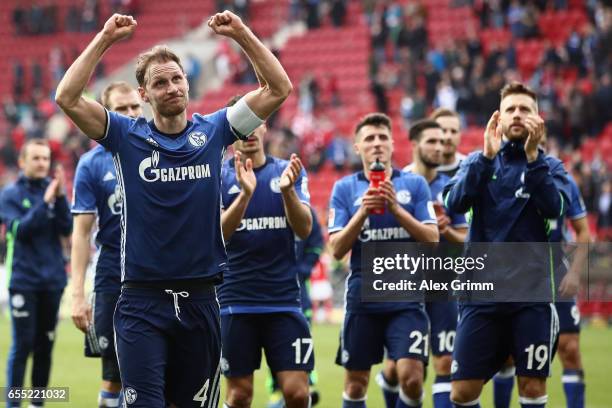 Benedikt Hoewedes of Schalke and team mates celebrate with the fans after the Bundesliga match between 1. FSV Mainz 05 and FC Schalke 04 at Opel...