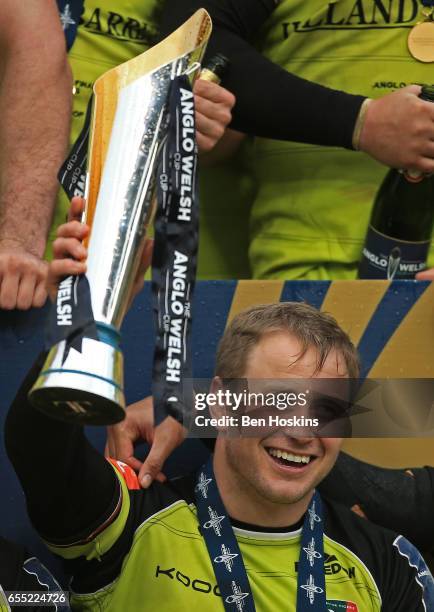 Captain Mathew Tait of Leicester Tigers lifts the trophy following his team's 16-12 victory during the Anglo-Welsh Cup Final between Exeter Chiefs...