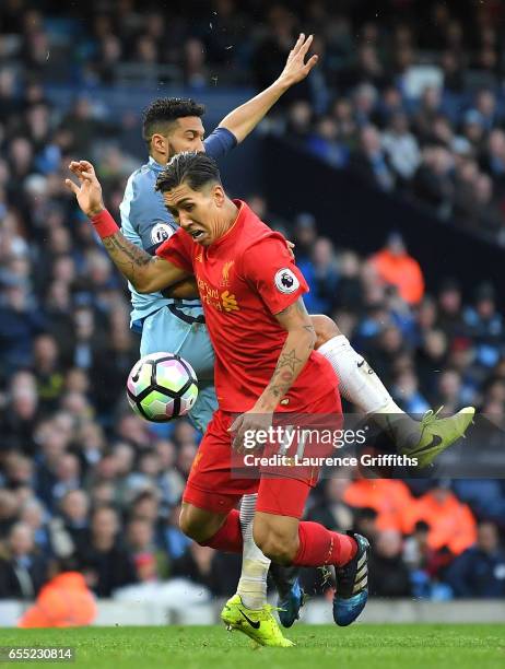 Gael Clichy of Manchester City fouls Roberto Firmino of Liverpool inside the box and a penalty is awarded to Liverpool during the Premier League...