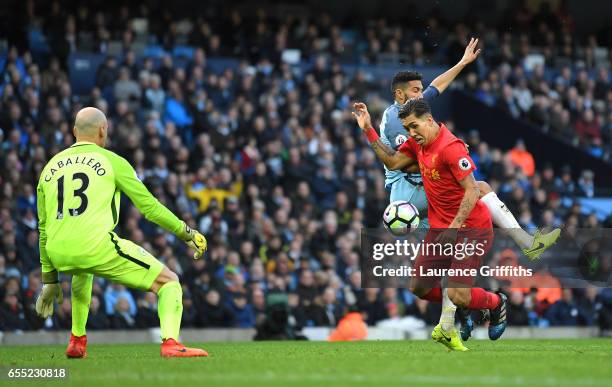 Gael Clichy of Manchester City fouls Roberto Firmino of Liverpool inside the box and a penalty is awarded to Liverpool during the Premier League...