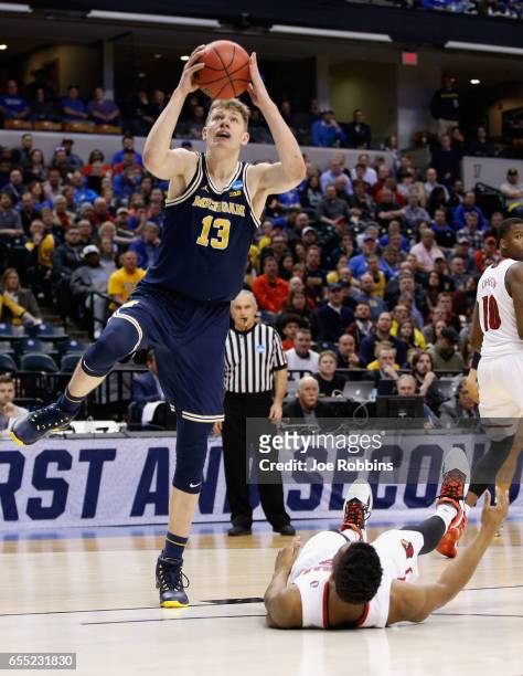 Moritz Wagner of the Michigan Wolverines shoots against the Louisville Cardinals in the first half during the second round of the 2017 NCAA Men's...
