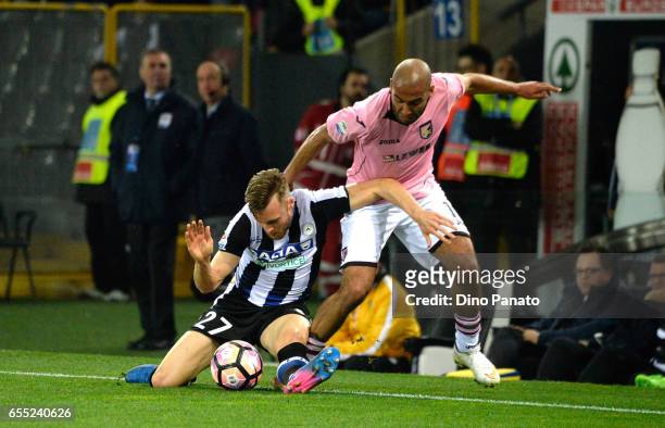 Silvan Widmer of Udinese Calcio competes with Haitam Aleesami of US Citta di Palermo during the Serie A match between Udinese Calcio and US Citta di...