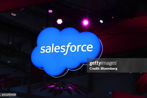 Salesforce.Com Inc. Logo sits on an illuminated icloud lightbox hanging from the ceiling at the CeBIT 2017 tech fair in Hannover, Germany, on Sunday,...