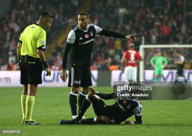 Cenk Tosun and Atiba Hutchinson of Besiktas talk with the referee during the Turkish Spor Toto Super Lig football match between Antalyaspor and...