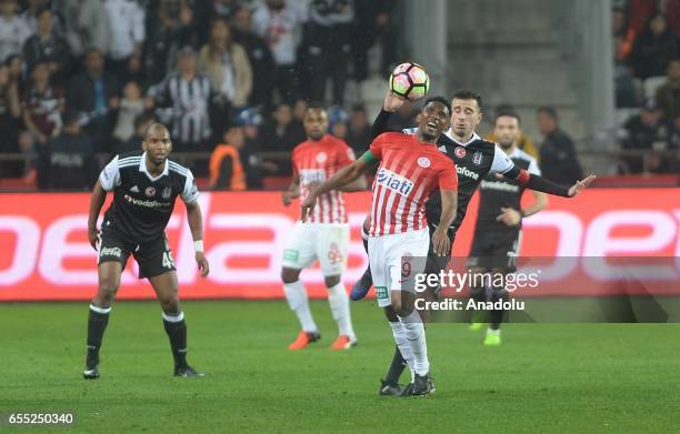 Oguzhan Ozyakup of Besiktas in action against Eto'o of Antalyaspor during the Turkish Spor Toto Super Lig football match between Antalyaspor and...