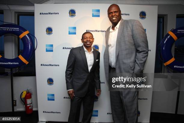 Golden State Warriors legends Muggsy Bogues and Adonal Foyle pose for a photo at the third American Express "All for Dub Nation" Watch Party on the...