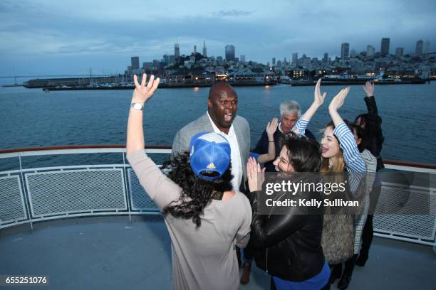 Golden State Warriors legend Adonal Foyle celebrates with fans at the third American Express "All for Dub Nation" Watch Party on the S.S. Dub Nation...