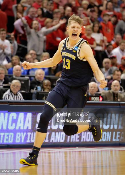 Moritz Wagner of the Michigan Wolverines celebrates their 73-69 win over the Louisville Cardinals during the second round of the 2017 NCAA Men's...