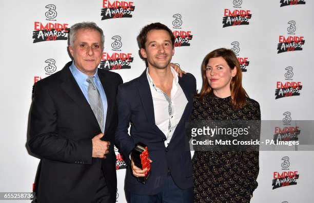 Producer Simon Halfon, Director Matt Whitecross and Producer Fiona Nielson with the award for Best Documentary for Supersonic in the winners room at...