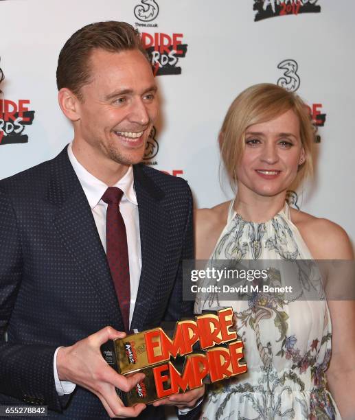 Tom Hiddleston and Anne-Marie Duff pose in the winners room at the THREE Empire awards at The Roundhouse on March 19, 2017 in London, England.