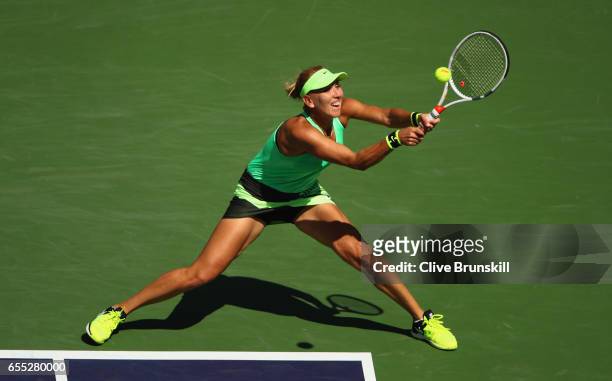 Elena Vesnina of Russia plays a backhand against Svetlana Kuznetsova of Russia in the womens final during day fourteen of the BNP Paribas Open at...