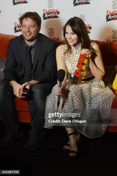 Director Gareth Edwards and Felicity Jones pose with the awards for Best Actress and Best Director for Rogue One: A Star Wars Story in the winners...