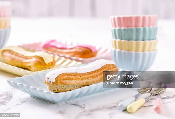 french confectionery, pink and white eclair - choux pastry stock pictures, royalty-free photos & images