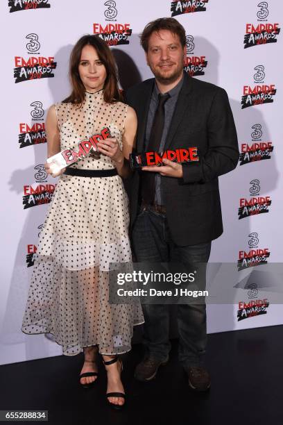 Felicity Jones and director Gareth Edwards pose with the awards for Best Actress and Best Director for Rogue One: A Star Wars Story in the winners...