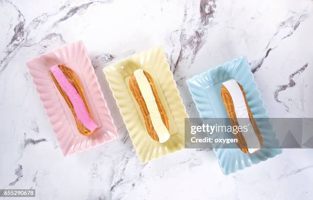 french confectionery, pink and white eclair - choux pastry stock pictures, royalty-free photos & images