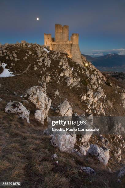 rocca calascio fortress with moon back, abruzzo region, italy - luogo d'interesse stock pictures, royalty-free photos & images