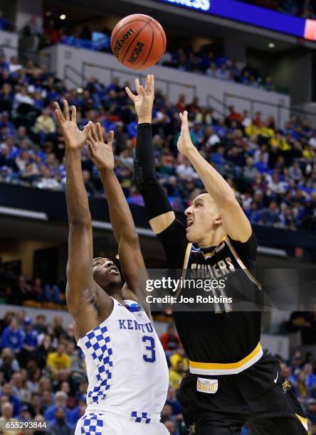 Landry Shamet of the Wichita State Shockers shoots against Edrice Adebayo of the Kentucky Wildcats in the second half during the second round of the...