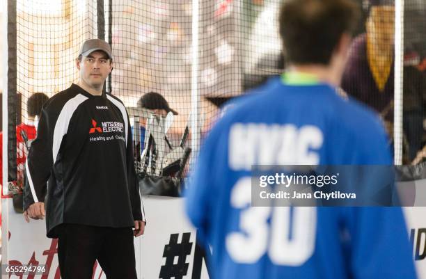 Former Ottawa Senators Chris Phillips watches the ball hockey game in the role of a referee at the NHL Centennial Fan Arena at the Aberdeen Pavilion...