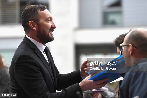 Actor Ralph Ineson signs an autograph at the THREE Empire awards at The Roundhouse on March 19, 2017 in London, England.