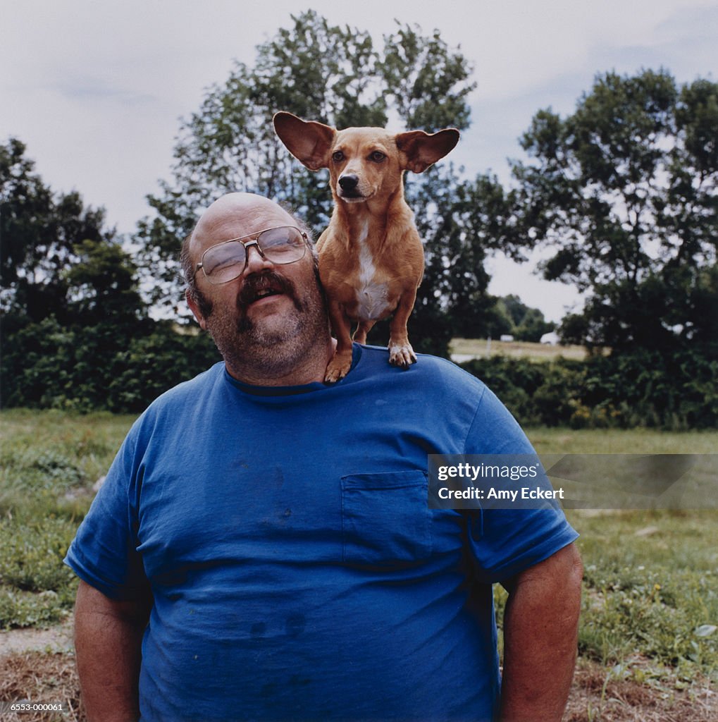 Man with Corgi on Shoulder