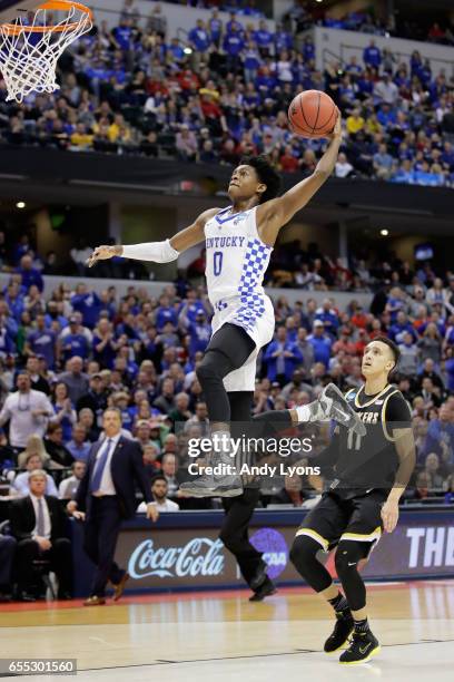 De'Aaron Fox of the Kentucky Wildcats dunks against Landry Shamet of the Wichita State Shockers in the second half during the second round of the...