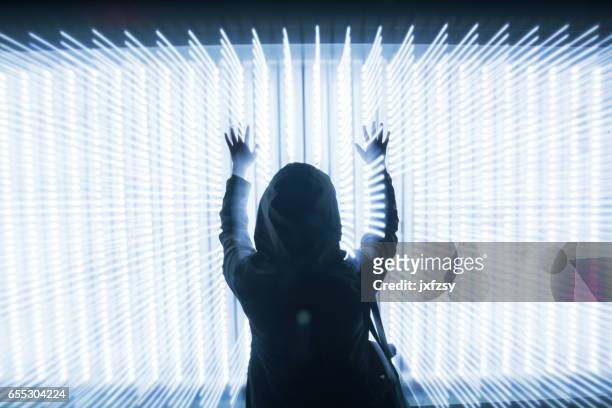 woman in front of led lights dots array - dimensions launch party stock pictures, royalty-free photos & images