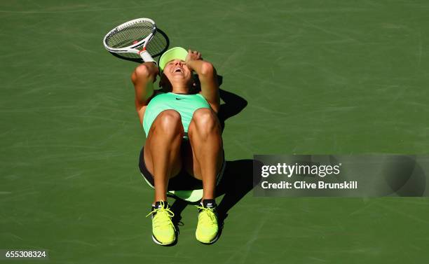 Elena Vesnina of Russia celebrates match point against Svetlana Kuznetsova of Russia in the womens final during day fourteen of the BNP Paribas Open...