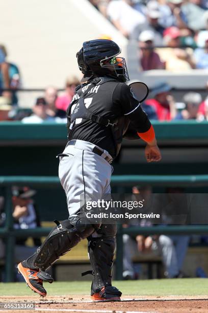 Ramon Cabrera of the Marlins throws the ball down to second base during the spring training game between the Miami Marlins and the Detroit Tigers on...