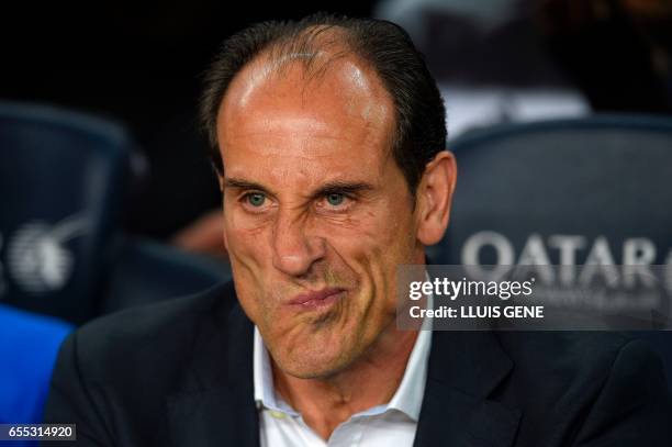 Valencia's coach Voro Gonzalez grimaces before the Spanish league football match FC Barcelona vs Valencia CF at the Camp Nou stadium in Barcelona on...