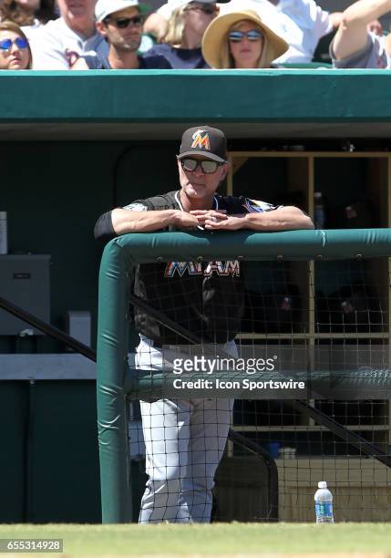Marlins manager Don Mattingly watches the action on the field during the spring training game between the Miami Marlins and the Detroit Tigers on...