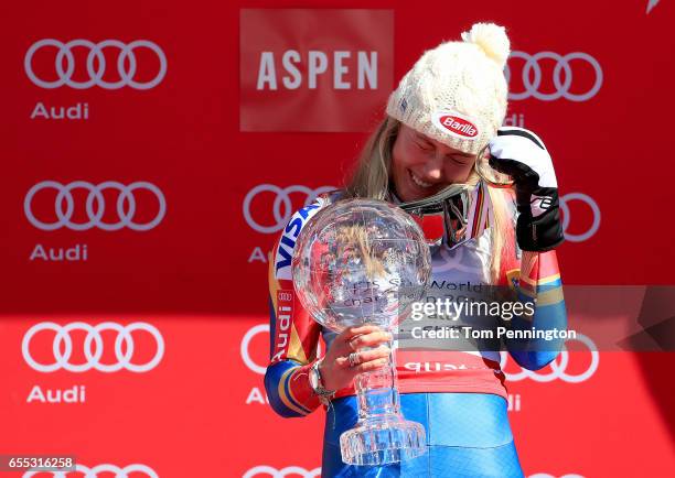 Mikaela Shiffrin of United States celebrates with the globe for being awarded the overall season ladies' champion at the 2017 Audi FIS Ski World Cup...