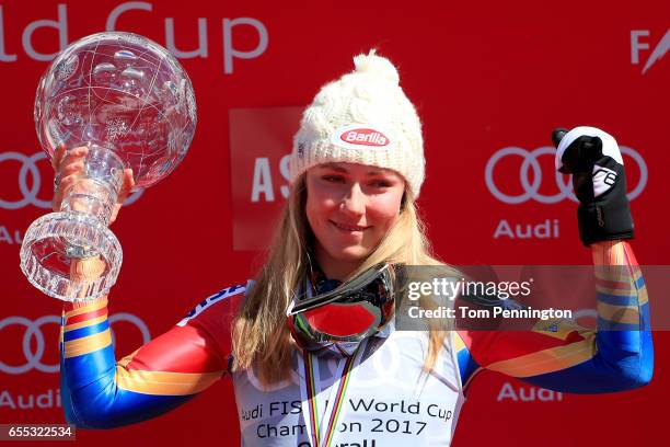 Mikaela Shiffrin of United States celebrates with the globe for being awarded the overall season ladies' champion at the 2017 Audi FIS Ski World Cup...