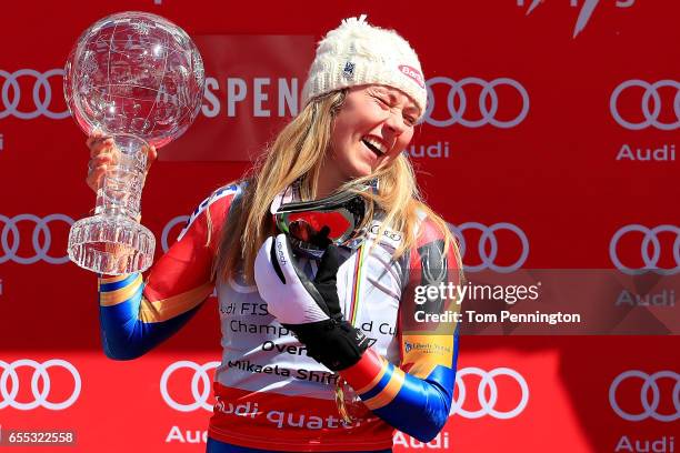 Mikaela Shiffrin of United States celebrates with the globe for being awarded the overall season ladies' champion at the 2017 Audi FIS Ski World Cup...