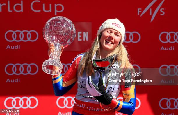 Mikaela Shiffrin of United States celebrates with the globe for being awarded the overall season ladies' champion at the 2017 Audi FIS Ski World Cup...