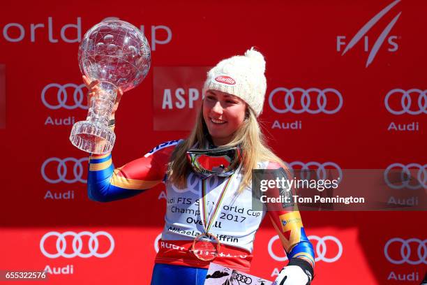 Mikaela Shiffrin of United States celebrates with the globe for being awarded the overall season ladies' champion at the 2017 Audi FIS Ski World Cup...