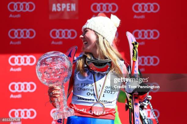 Mikaela Shiffrin of United States celebrates with the globe for being awarded the overall season ladies' champion at the 2017 Audi FIS Ski World Cup...