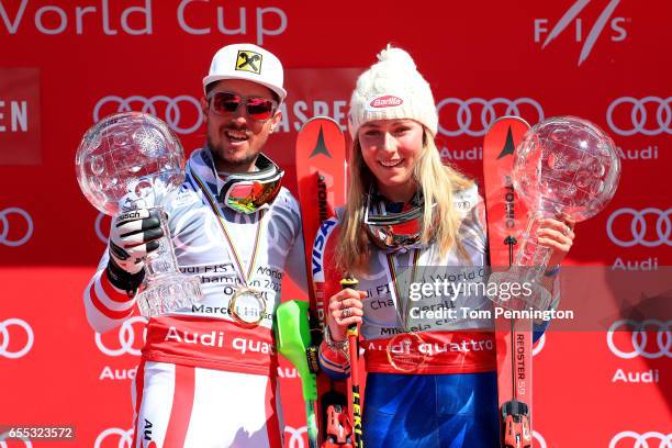 Marcel Hirscher of Austria and Mikaela Shiffrin of United States celebrates with the globes for being awarded the overall season men's and ladies'...