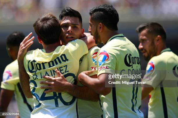 Silvio Romero of America celebrates after scoring the first goal of his team during the 11st round match between Pumas UNAM and America as par of the...