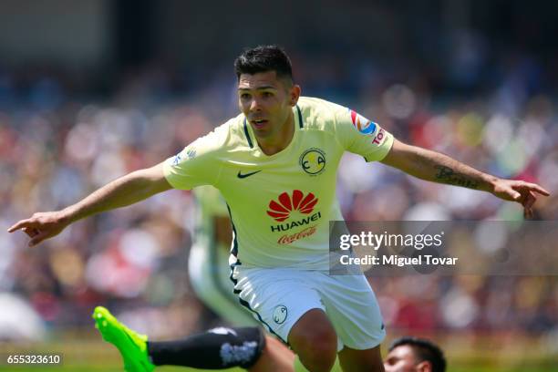 Silvio Romero of America celebrates after scoring the first goal of his team during the 11st round match between Pumas UNAM and America as par of the...