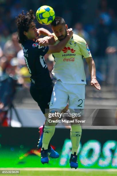 Matias Britos of Pumas fights for the ball with Jose Guerrero of America during the 11st round match between Pumas UNAM and America as par of the...