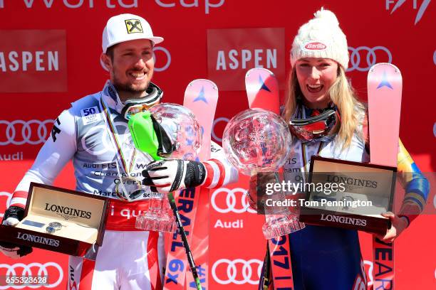 Marcel Hirscher of Austria and Mikaela Shiffrin of United States celebrates with the globes for being awarded the overall season men's and ladies'...