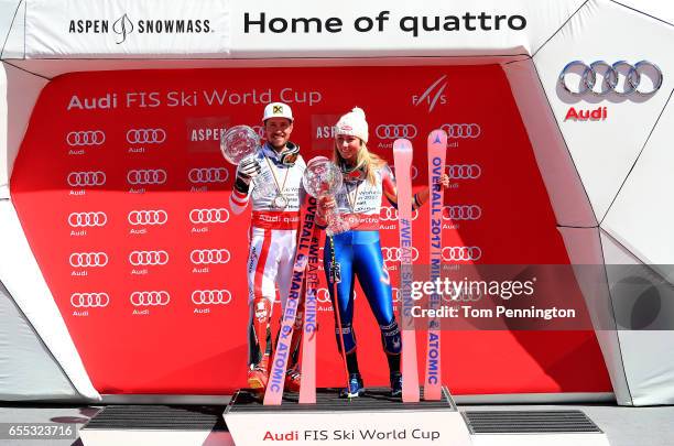 Marcel Hirscher of Austria and Mikaela Shiffrin of United States celebrates with the globes for being awarded the overall season men's and ladies'...