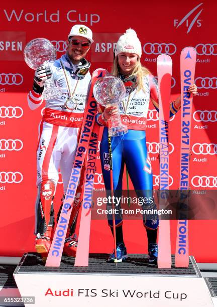 Marcel Hirscher of Austria and Mikaela Shiffrin of United States celebrates with the globes for being awarded the overall season men's and ladies'...