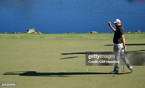 Marc Leishman of Australia celebrates on the 18th green after finishing 11 under to win during the final round of the Arnold Palmer Invitational...