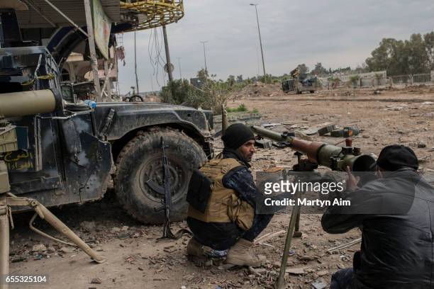 Iraqi Emergency Response soldier aims an RPG grenade launcher at an Islamic State position during their advance into Bab al-Tob, a neighbourhood in...