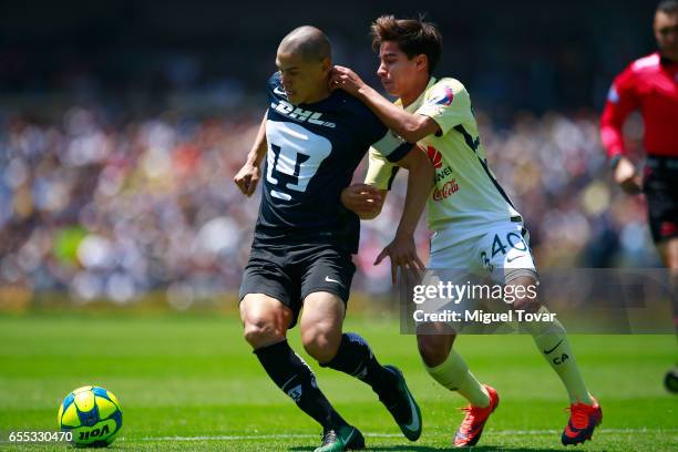 Dario Veron of Pumas fights for the ball with Cecilio Dominguez of America during the 11st round match between Pumas UNAM and America as par of the...