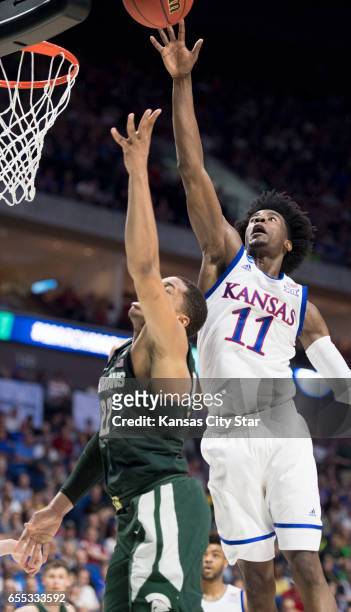 Michigan State Spartans guard Miles Bridges tries to get the ball past Kansas Jayhawks guard Josh Jackson in the first half of a second round NCAA...