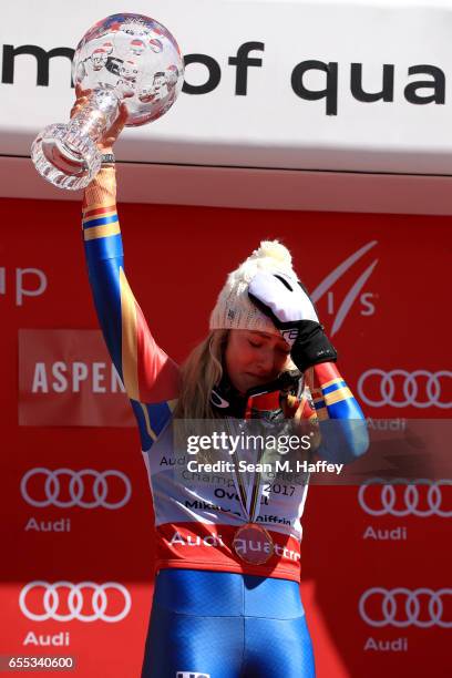 Mikaela Shiffrin of United States celebrates with the globe for being awarded the overall season ladies' champion at the 2017 Audi FIS Ski World Cup...