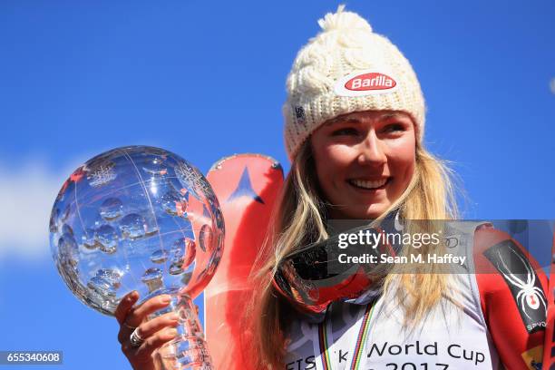 Mikaela Shiffrin of United States celebrates with the globe for being awarded the overall season ladies' champion at the 2017 Audi FIS Ski World Cup...